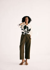 A Model Wearing Olive Cotton Twill Olive Trousers curated by Only Ethikal